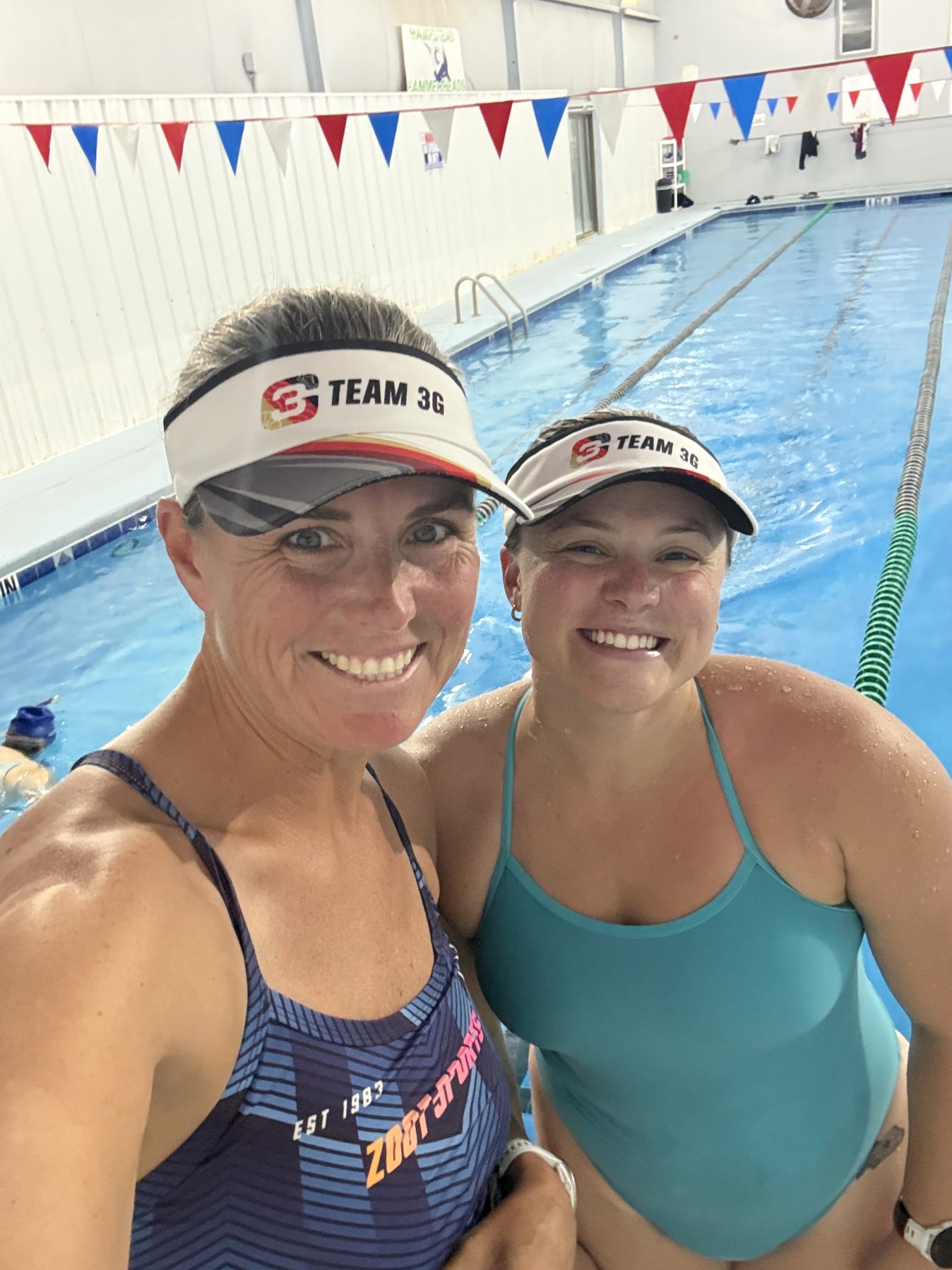 Coach Erin and Coach Katie together at the pool